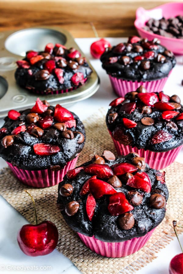 Healthy chocolate muffins with fresh cherries