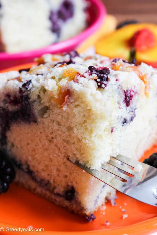 Moist, light and buttery peach and berry coffee crumb cake