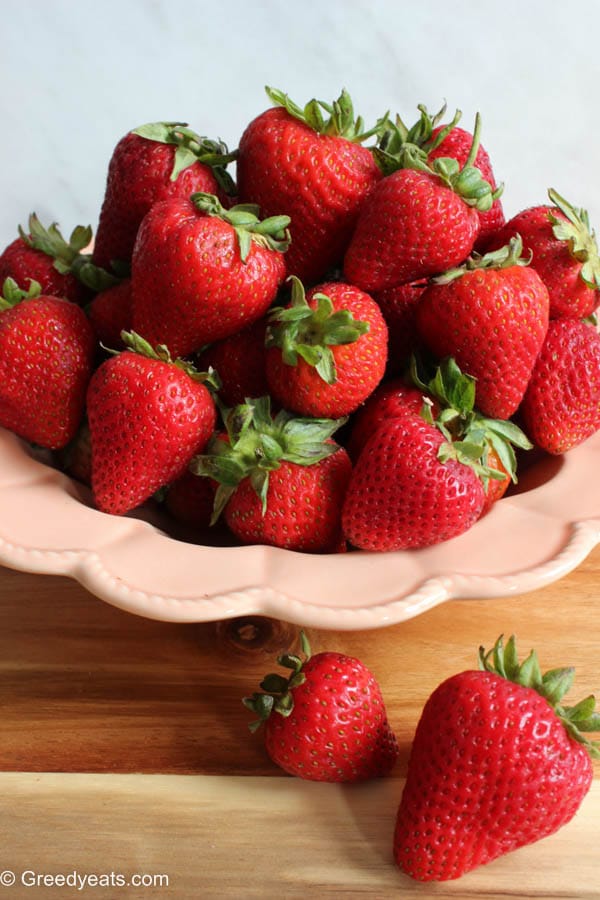 Fresh red Strawberries stacked on a bowl. 