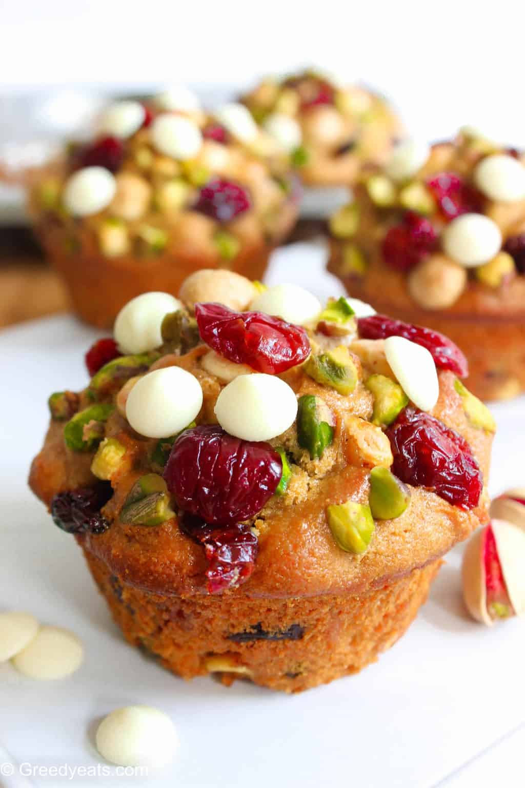 Whole wheat cranberry muffins with orange zest and pistachios.