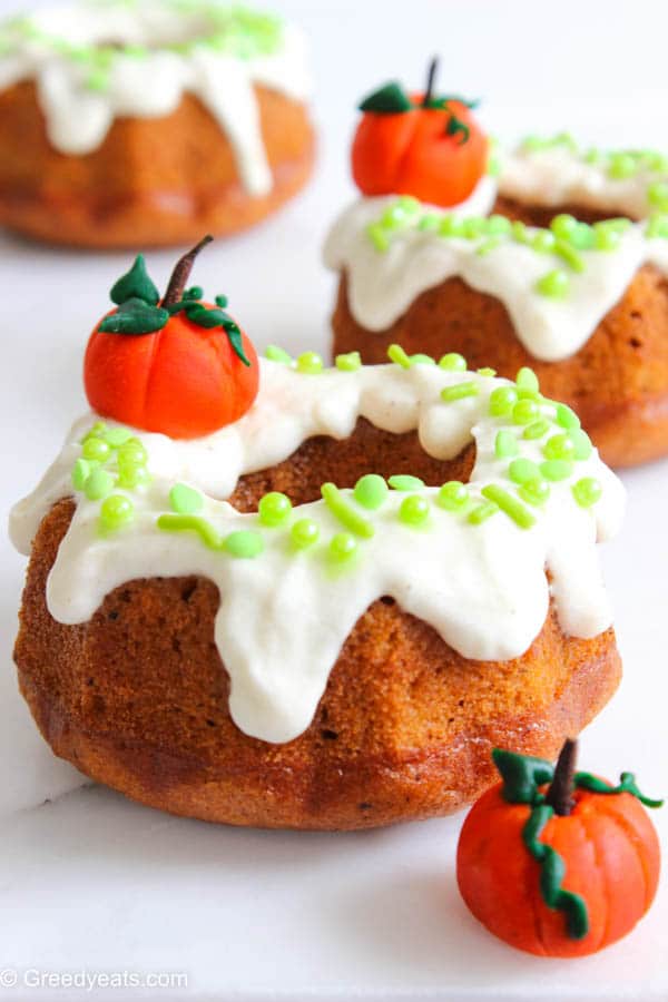 Perfectly spiced and deliciously moist mini Pumpkin Bundt Cakes topped with Cream Cheese Frosting.