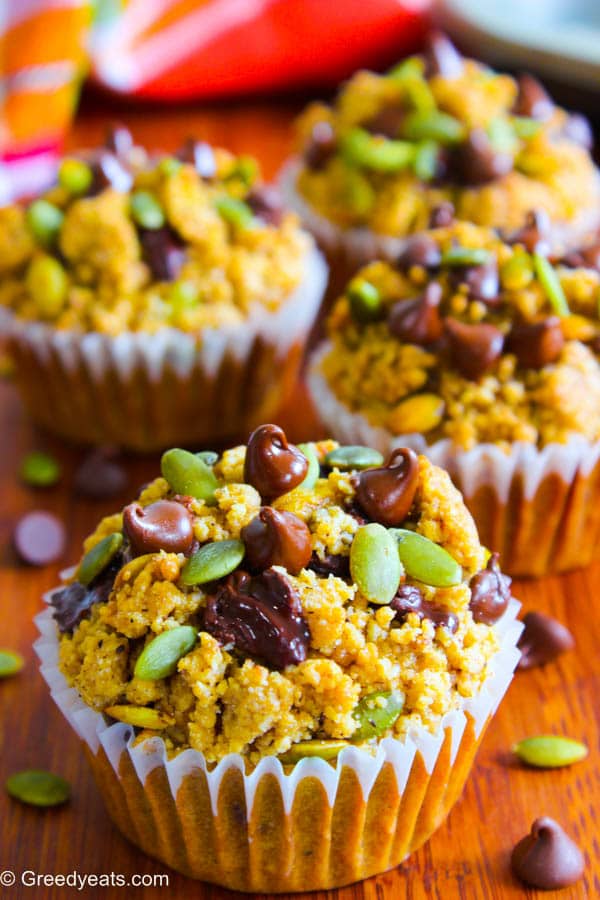 Healthy pumpkin crumb muffins with apple sauce, topped with pepitas and chocolate chips. 