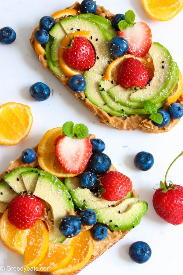 Simple avocado toast recipe with oranges blueberries and strawberries