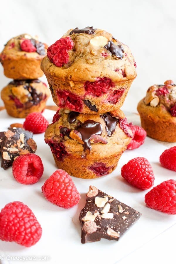 Healthy raspberry muffins recipe that is super moist, sweetened with honey, whole wheat and banana puree