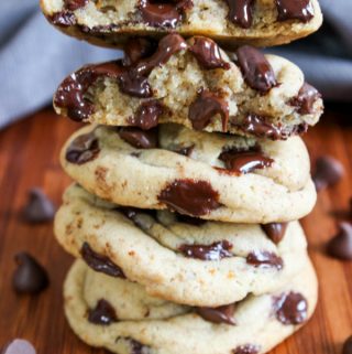 Stack of super thick and chewy small batch chocolate chip cookie recipe with soft baked interiors and melty chocolate chips.