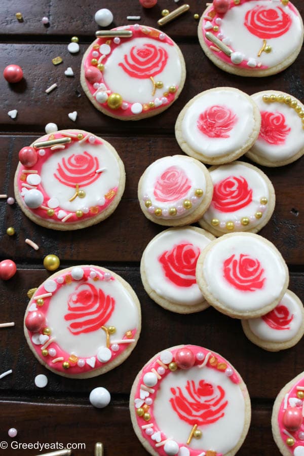 The best sugar cookie recipe with perfect edges, flat tops and minimum spread. They are decorated as rose cookies using an easy sugar cookie frosting!