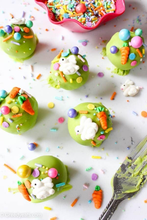 Easy and festive easter cake pops made with homemade chocolate cake, chocolate ganache frosting and easter bunny and carrot sprinkles