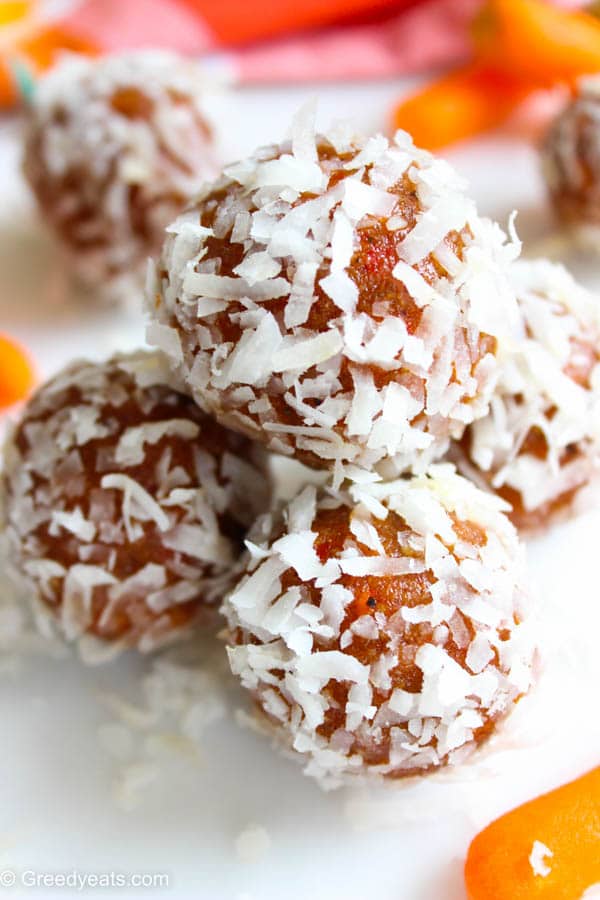 Spiced Carrot Cake Balls made with freshly grated carrots and coated in sweetened Coconut Flakes.