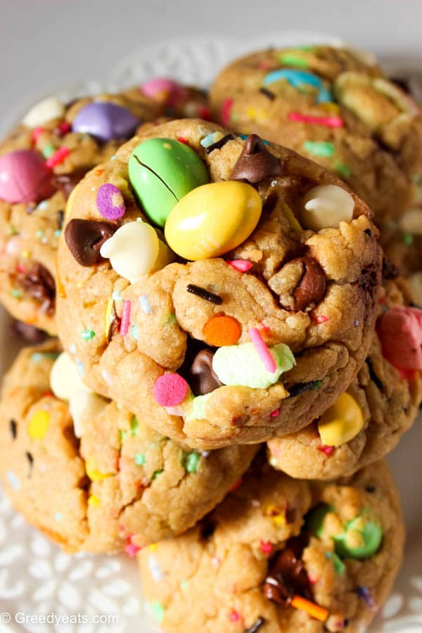 Super thick soft chewy chocolate chip cookies baked as easter cookies- with easter eggs, marshmallows, sprinkles and white chocolate chips