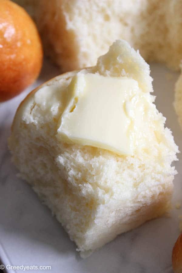 A fluffy and soft dinner roll topped with little butter. These are the best Dinner rolls ever!