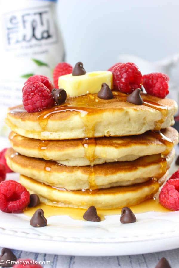 Soft, fluffy, quick and easy pancakes recipe on Greedyeats.com