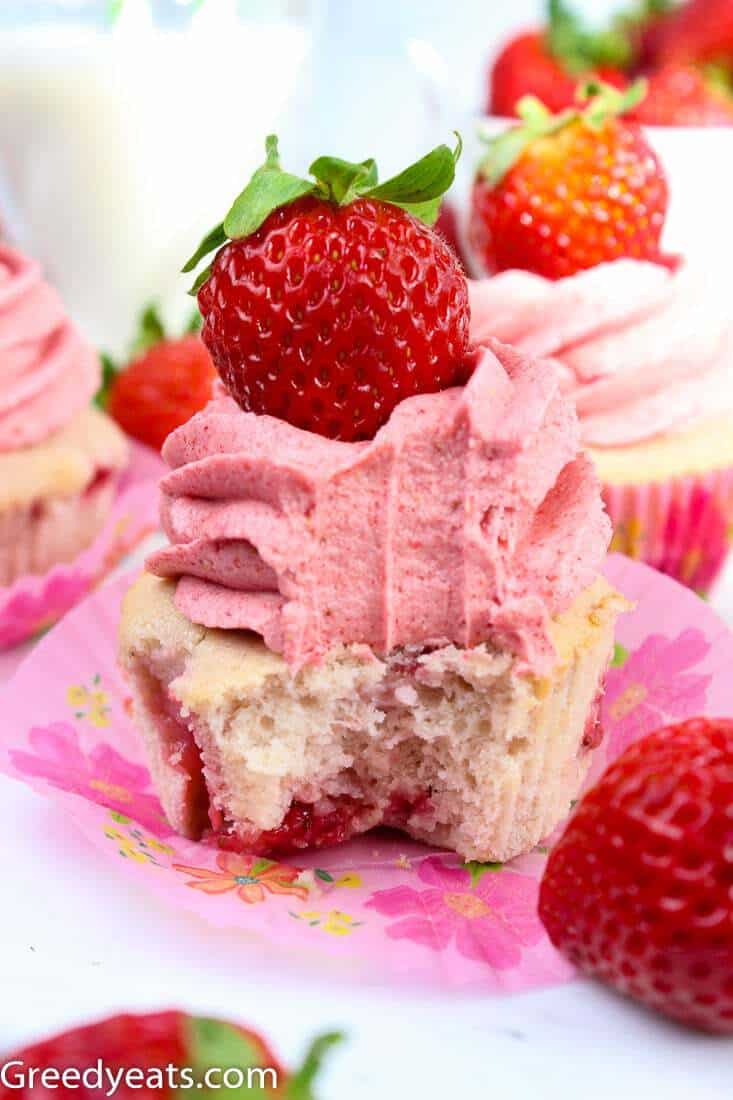 Soft and dotted with real strawberries, these are the best Strawberry Cupcakes topped with creamy Strawberry Frosting.