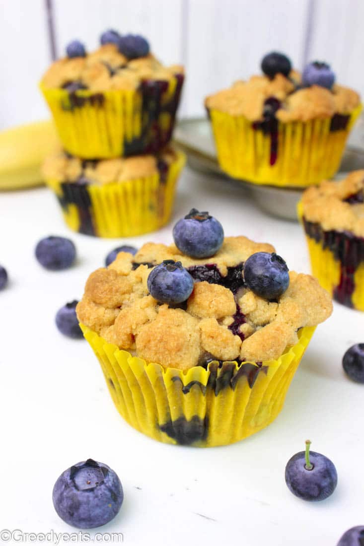 These buttery, soft and moist banana blueberry muffins are topped with thick and crunchy cinnamon streusel!