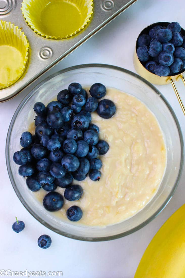 Homemade muffin mix for Banana blueberry muffin recipe with fresh blueberries.