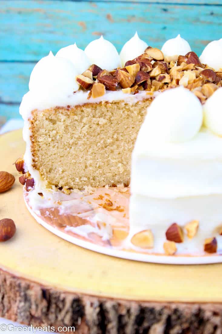 Best almond cake recipe for a soft, moist and tender cake frosted with almond cream cheese frosting!