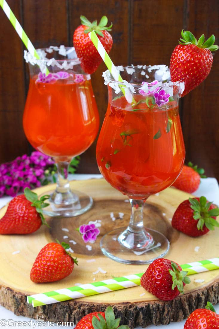 Fresh and fruity strawberry lemonade punch to enjoy on a hot summer day! Recipe on Greedyeats.com