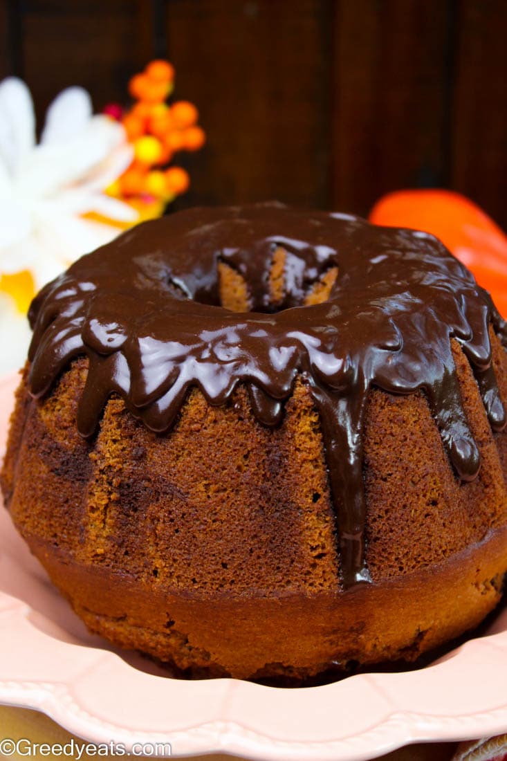 Drizzled with thick chocolate glaze recipe, this sweet potato cake rises super tall and bakes so rich and tender.