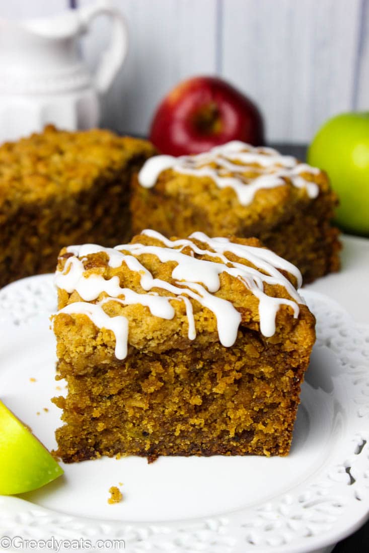 Apple coffee cake bursting with fall flavors and topped with buttery cinnamon streusel and vanilla glaze