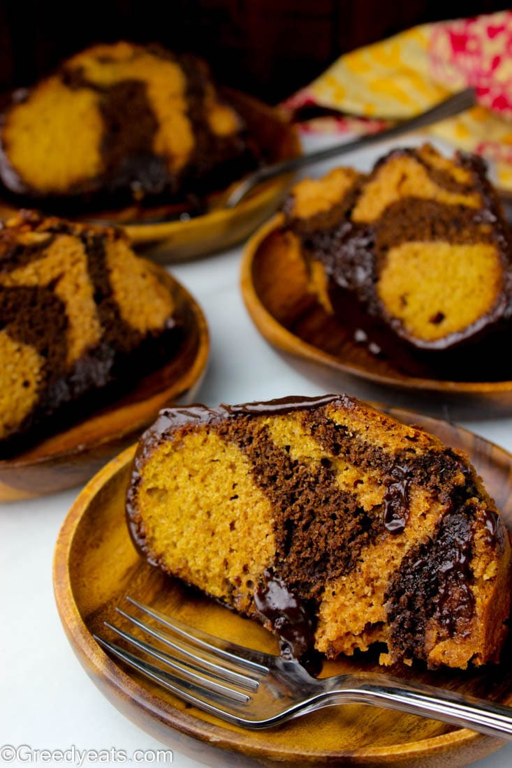 Brimming with warm spices, hiding thick chocolate swirls this sweet potato cake recipe is all you need!