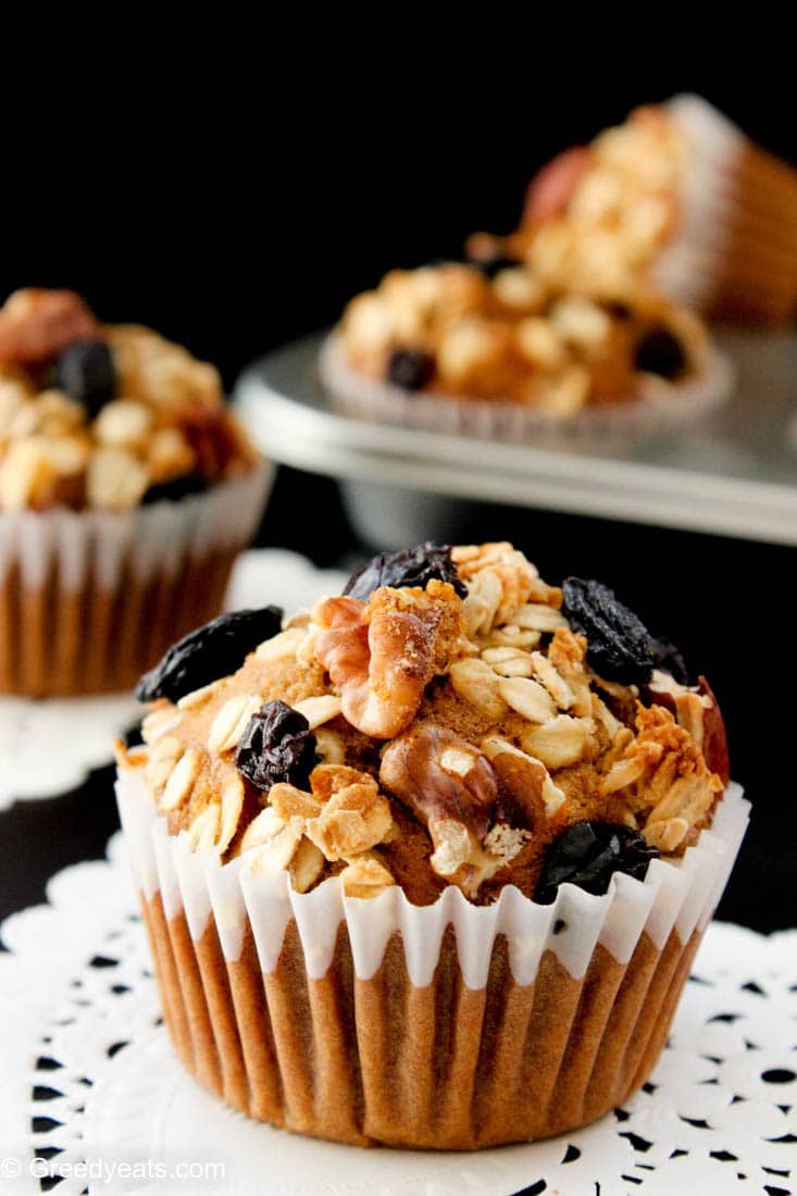 Freshly baked, warm and nutty banana breakfast muffins on doilies.