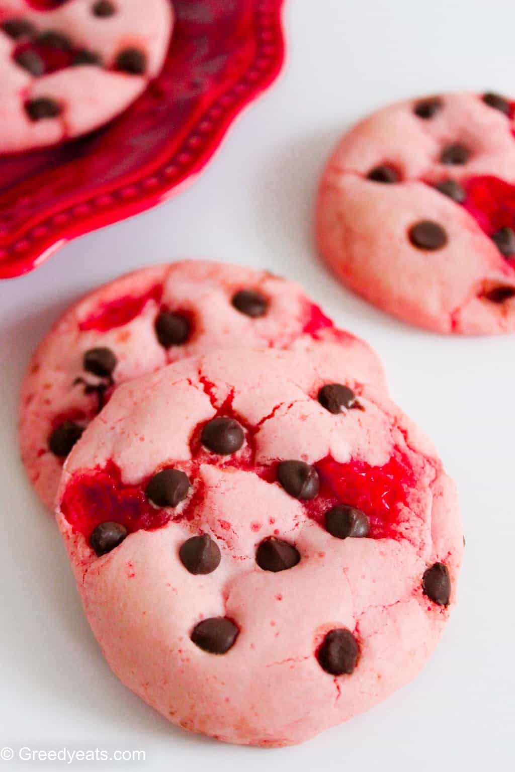 Studded with cherry bits and melty choc chip cookies these strawberry chocolate chip cookies will be new favorite Christmas cookies!