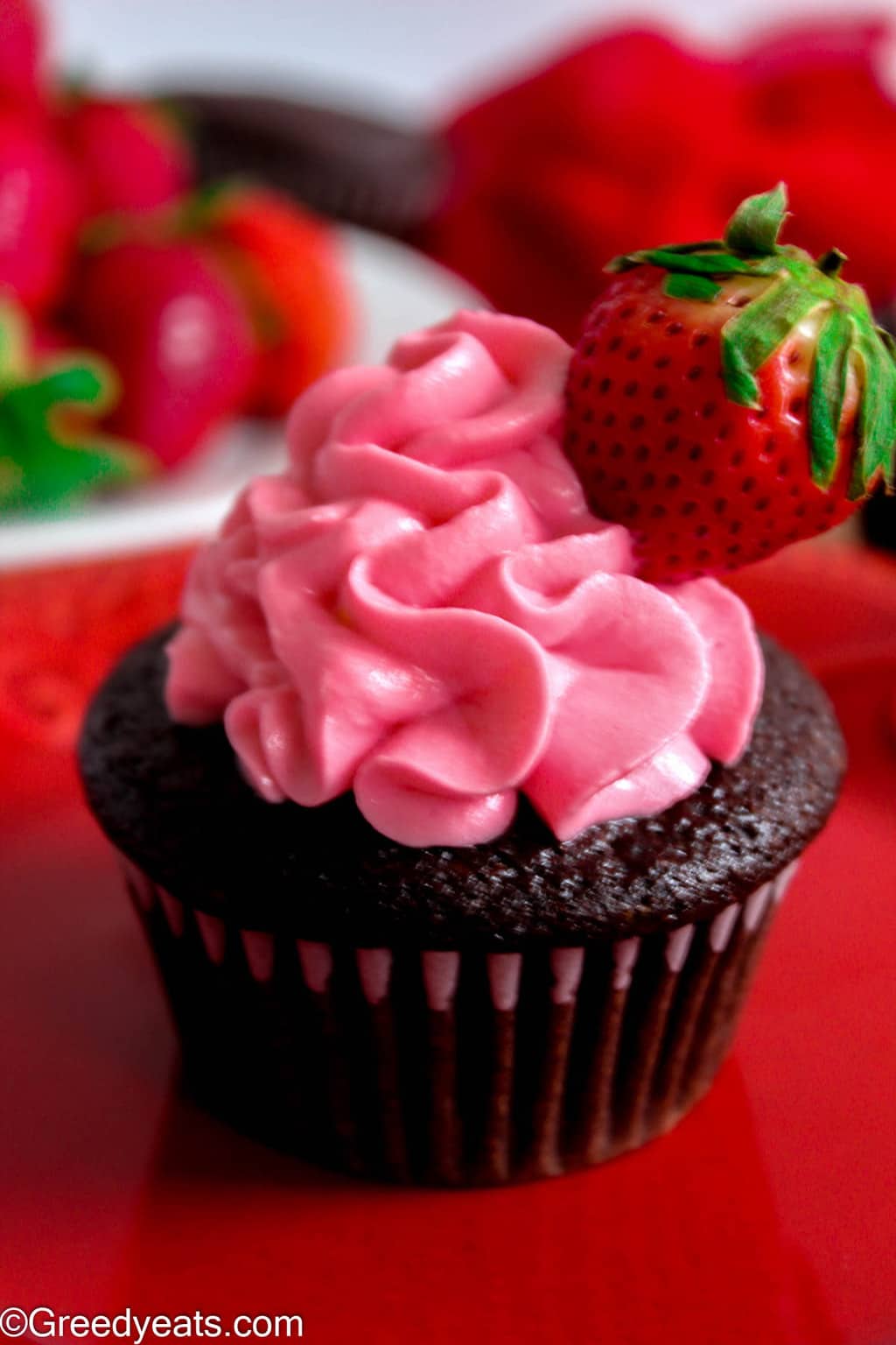 Easy strawberry cupcakes frosted with dreamy strawberry whipped cream frosting.