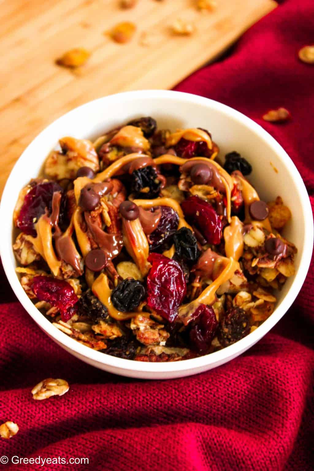 Healthy homemade trail mix baked granola recipe with nuts and berries