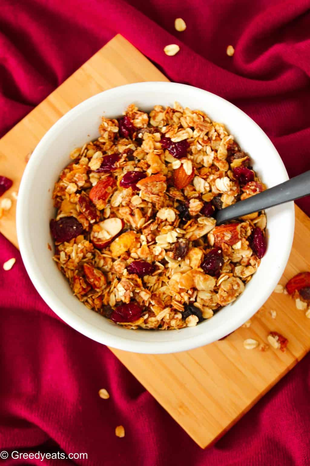 Healthy homemade trail mix baked granola recipe with nuts and berries