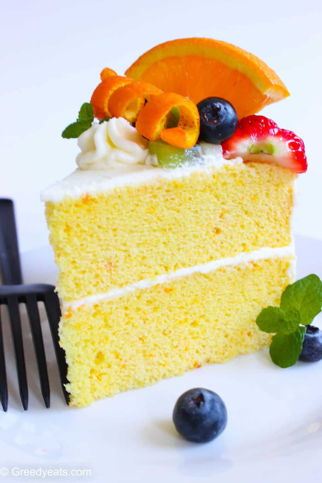 Soft, fluffy and moist orange chiffon cake recipe with fresh fruits.