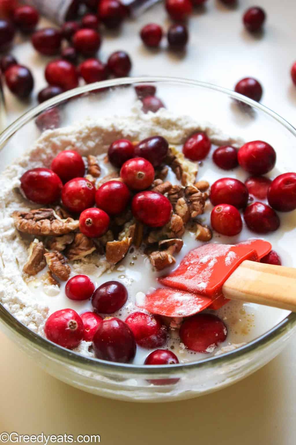 Fresh cranberry cake recipe batter with cranberry and pecans.