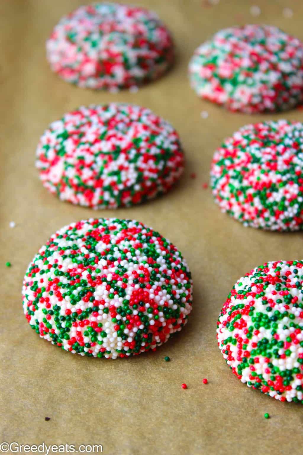 Soft, thick and Easy sugar Cookies rolled in Christmas Sprinkles