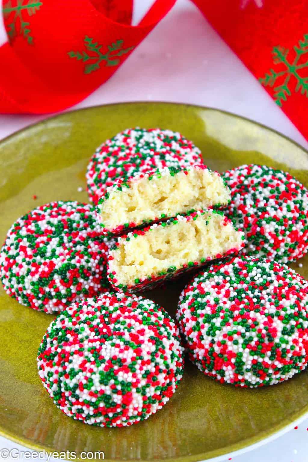 Puffy, chewy and soft sugar cookies made with cream cheese and Christmas sprinkles for your Holiday Cookie Tray!
