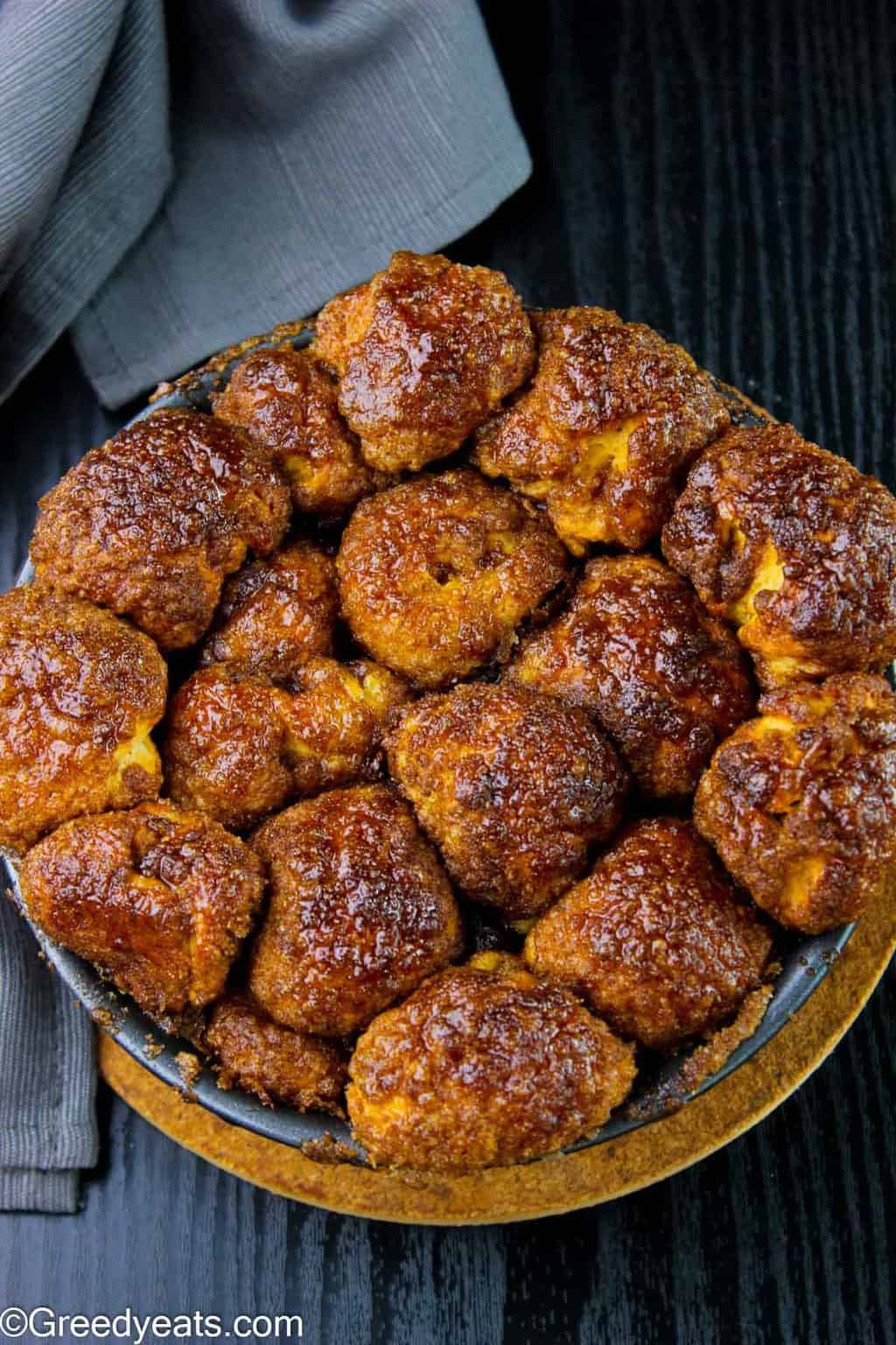 Easy Monkey Bread recipe baked in a bundt pan! Just roll, arrange, bake this pull apart bread.