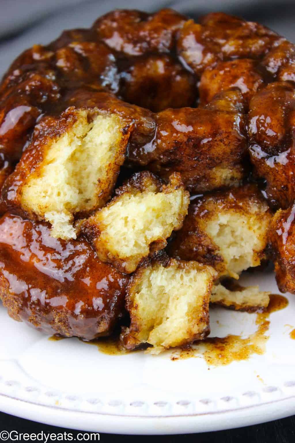 Soft and buttery bread is covered in sticky and gooey cinnamon sauce. Best monkey bread ever!