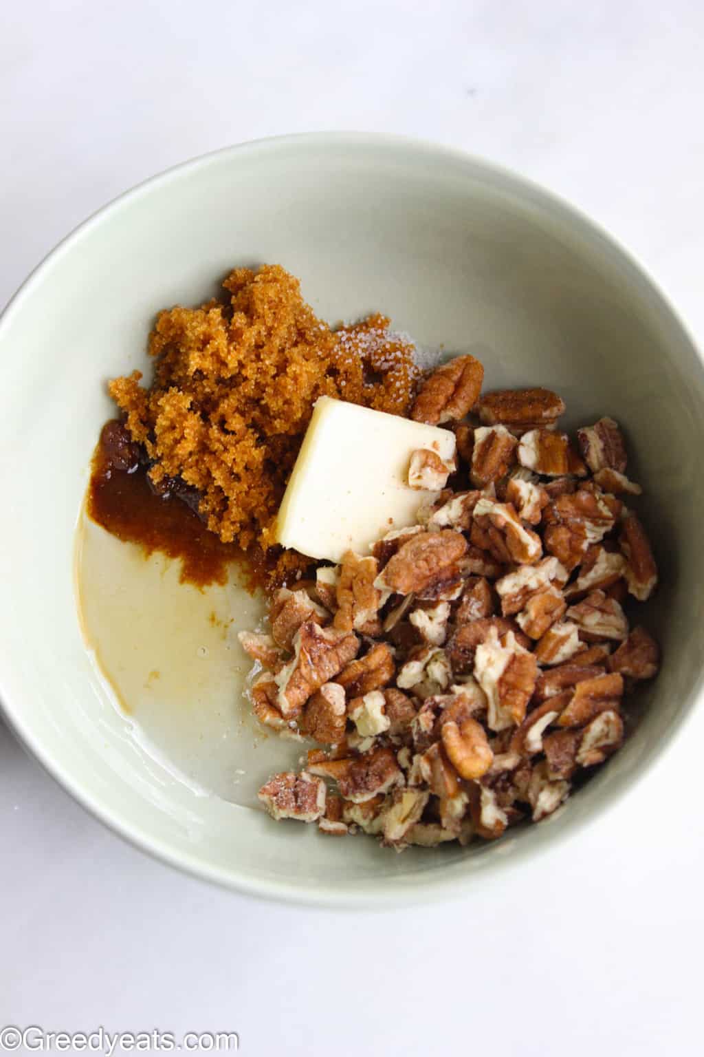 Easy pecan pie filling ingredients- chopped pecans, butter, corn syrup, brown sugar, salt and vanilla.