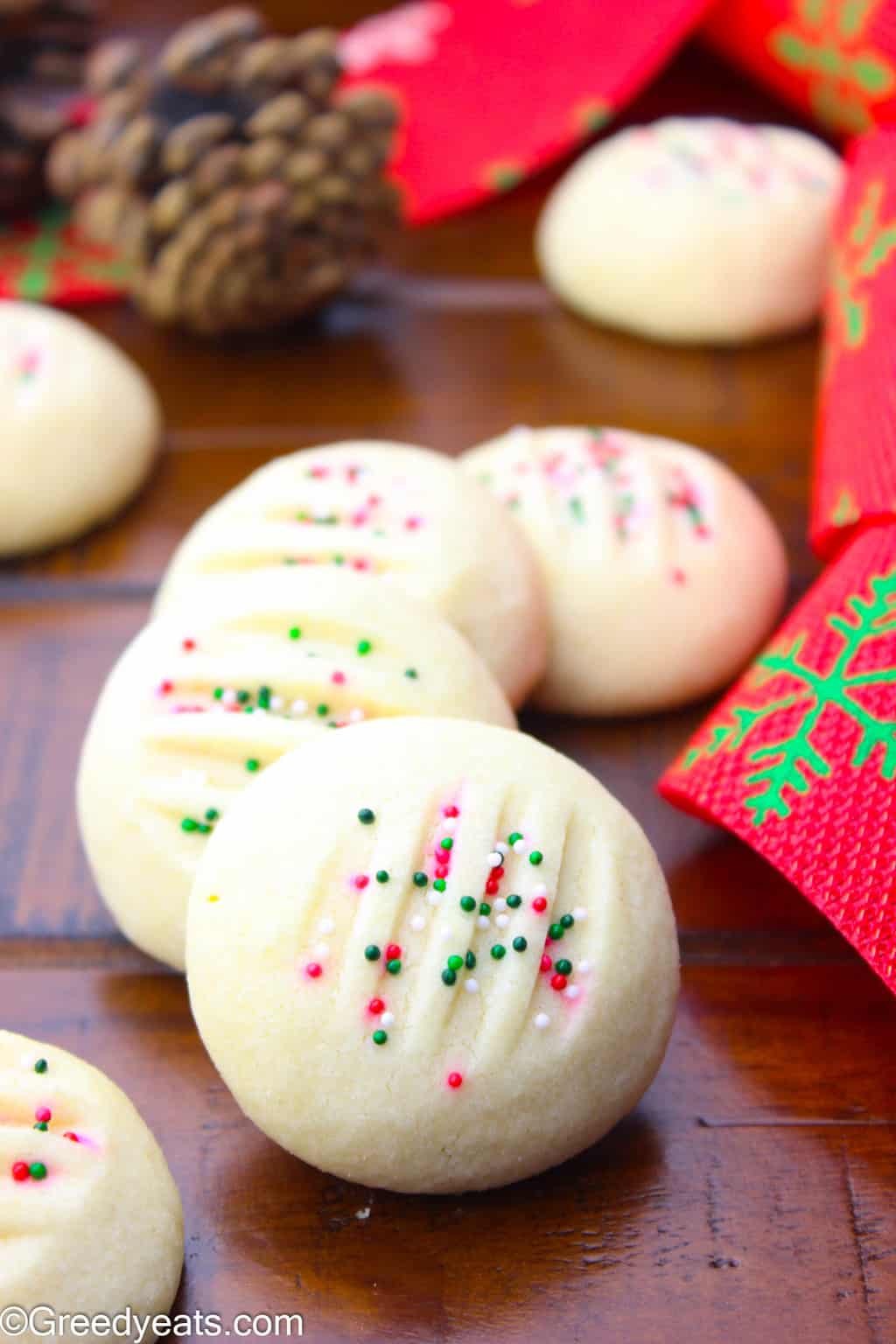 Dotted with festive sprinkles and made with one secret ingredient that bakes puffy whipped Shortbread Cookies always!
