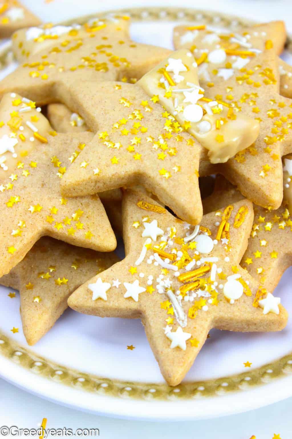 Soft, chewy and thick star sugar cookies flavored with cinnamon and maple icing.