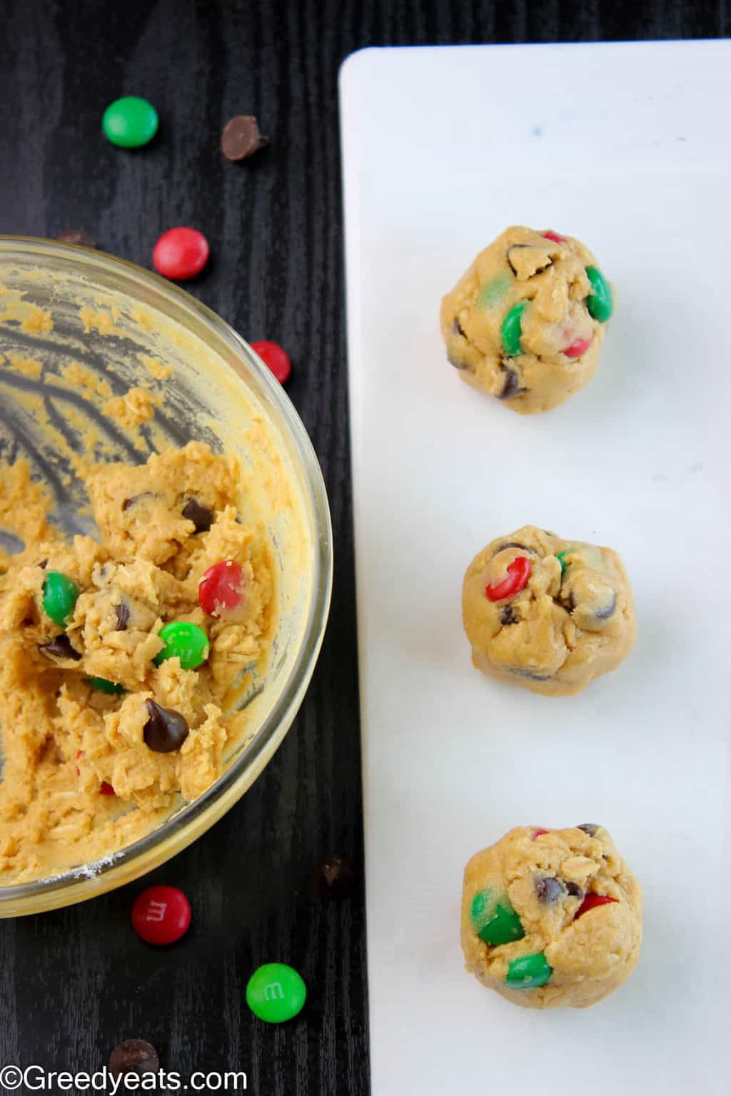 Monster cookie dough balls with chocolate chips and Christmas M&Ms.