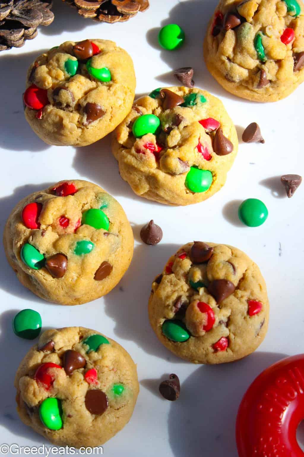 Soft and thick monster Cookies studded with red and green M & M s and chocolate chips.