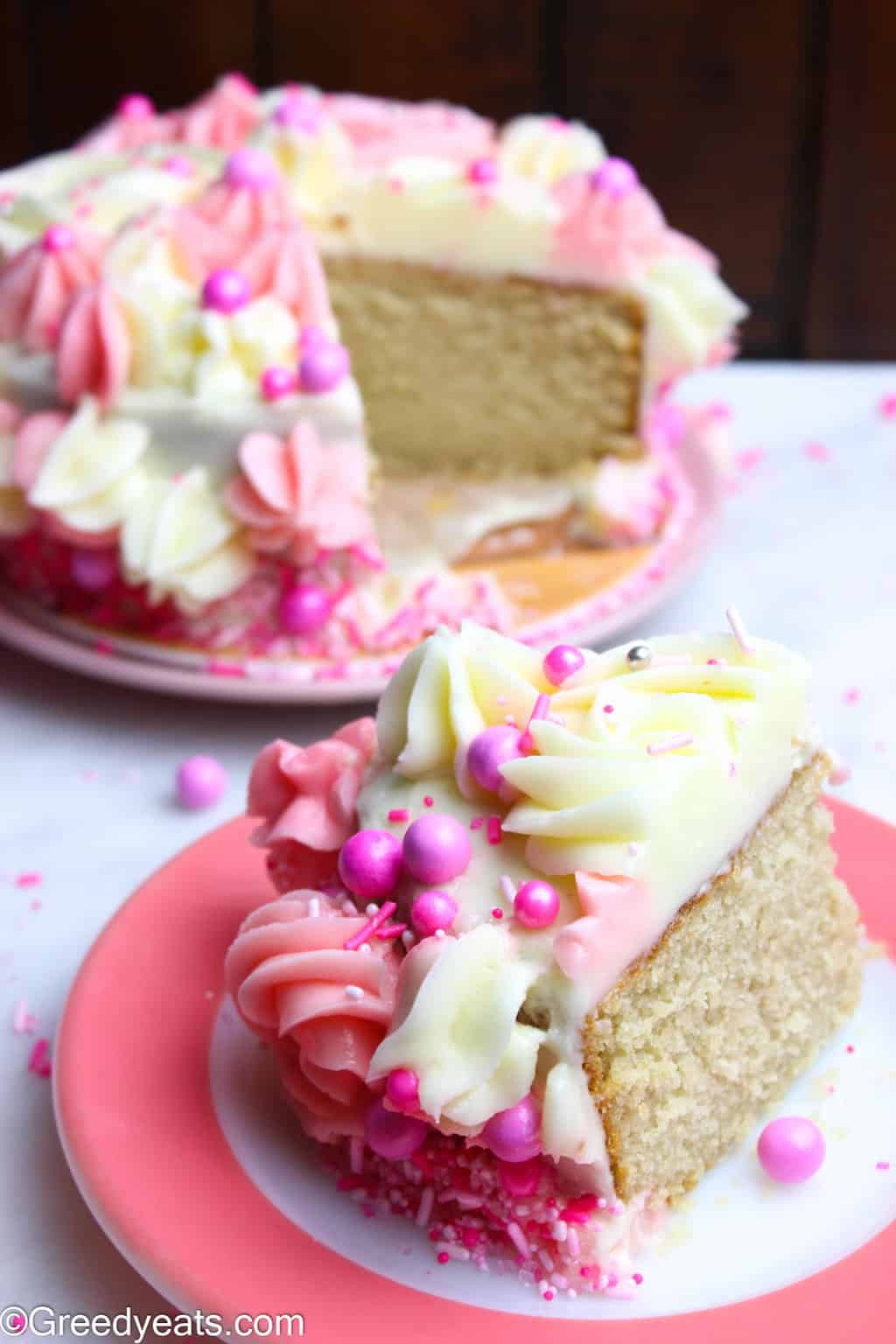 Small Vanilla Cake with silky Vanilla Buttercream dressed in pink.