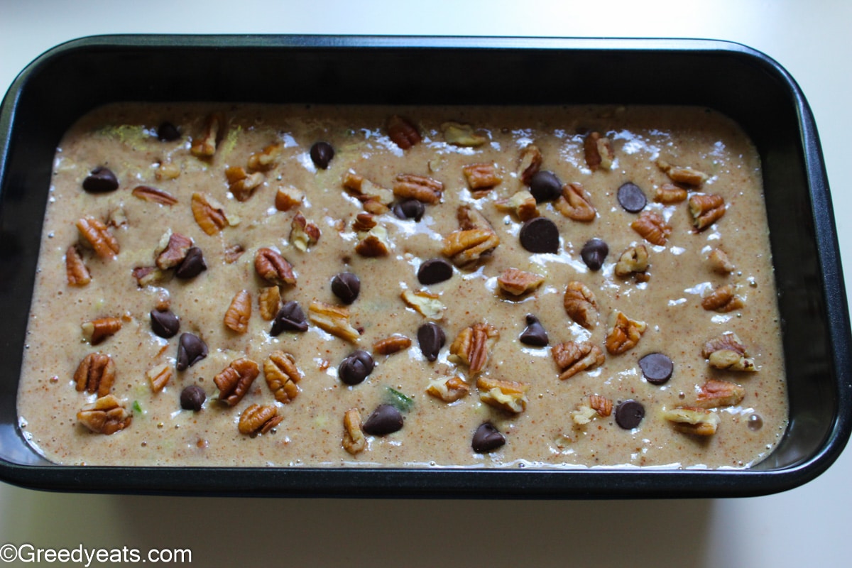 Healthy zucchini batter in a loaf pan ready to be baked.