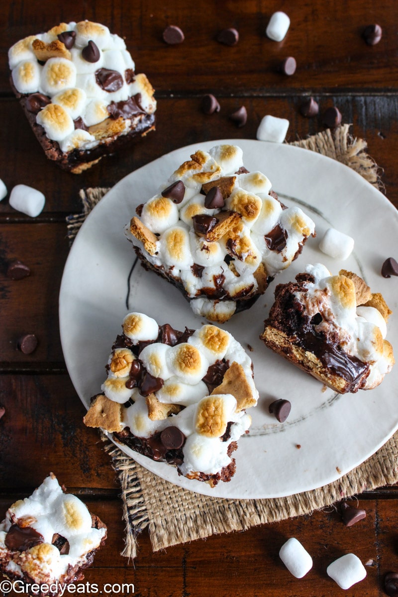 Homemade Brownies made with oil as Smores Brownies on a white plate. 