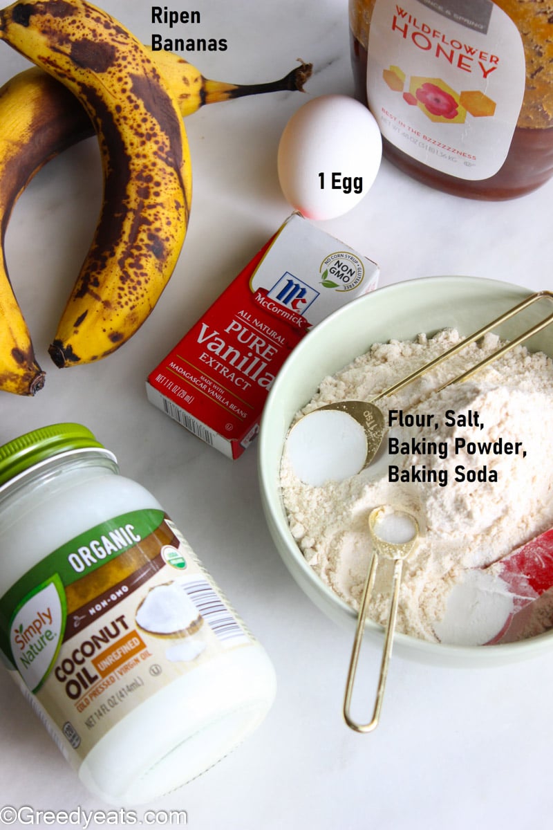 Banana muffins ingredients like wheat flour, leaveners, coconut oil, honey and egg.