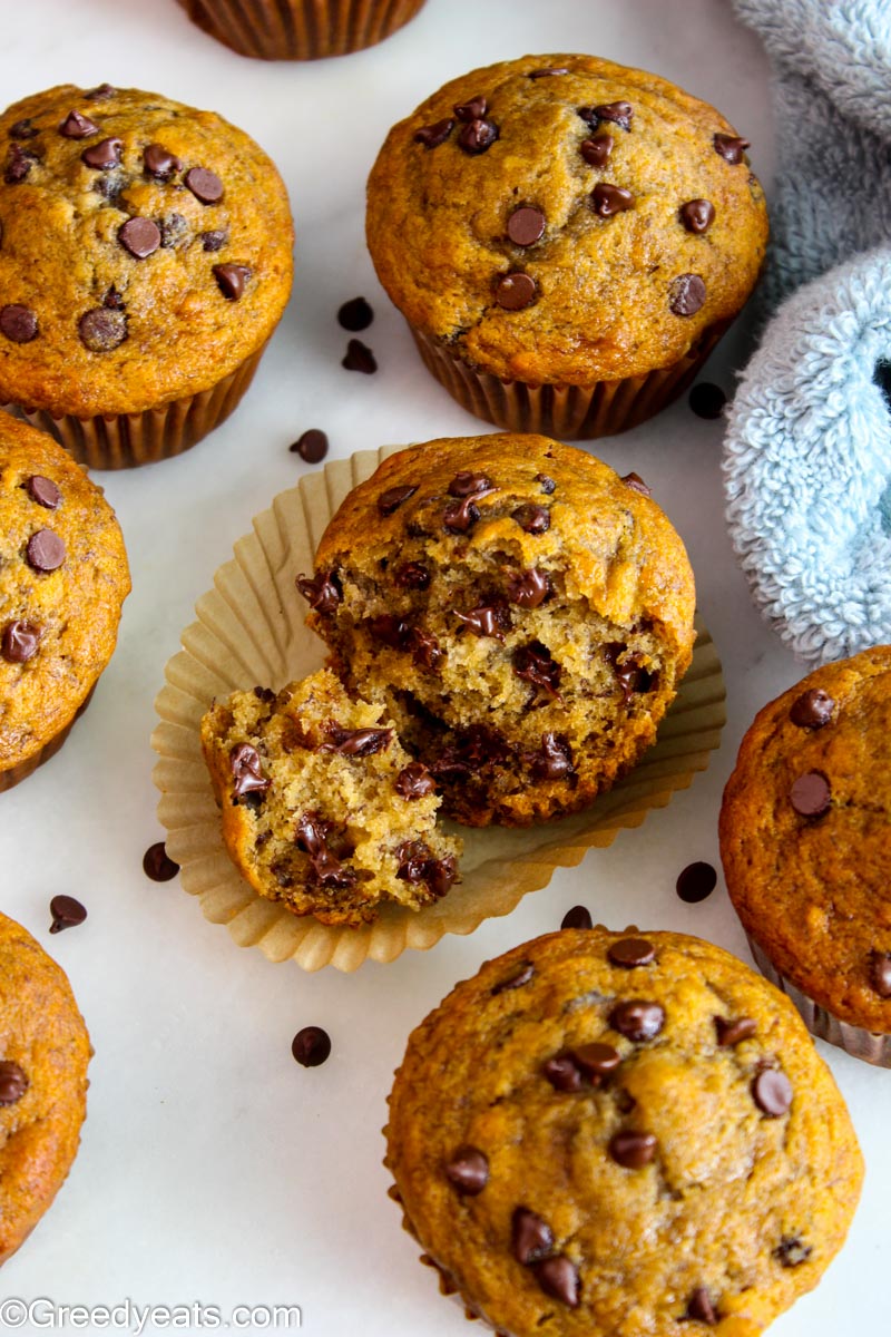 Healthy Banana Muffins with mini chocolate chips on a white board.