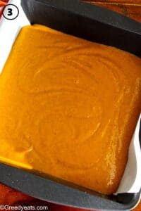 Pumpkin bars batter in a baking pan lined with parchment paper.