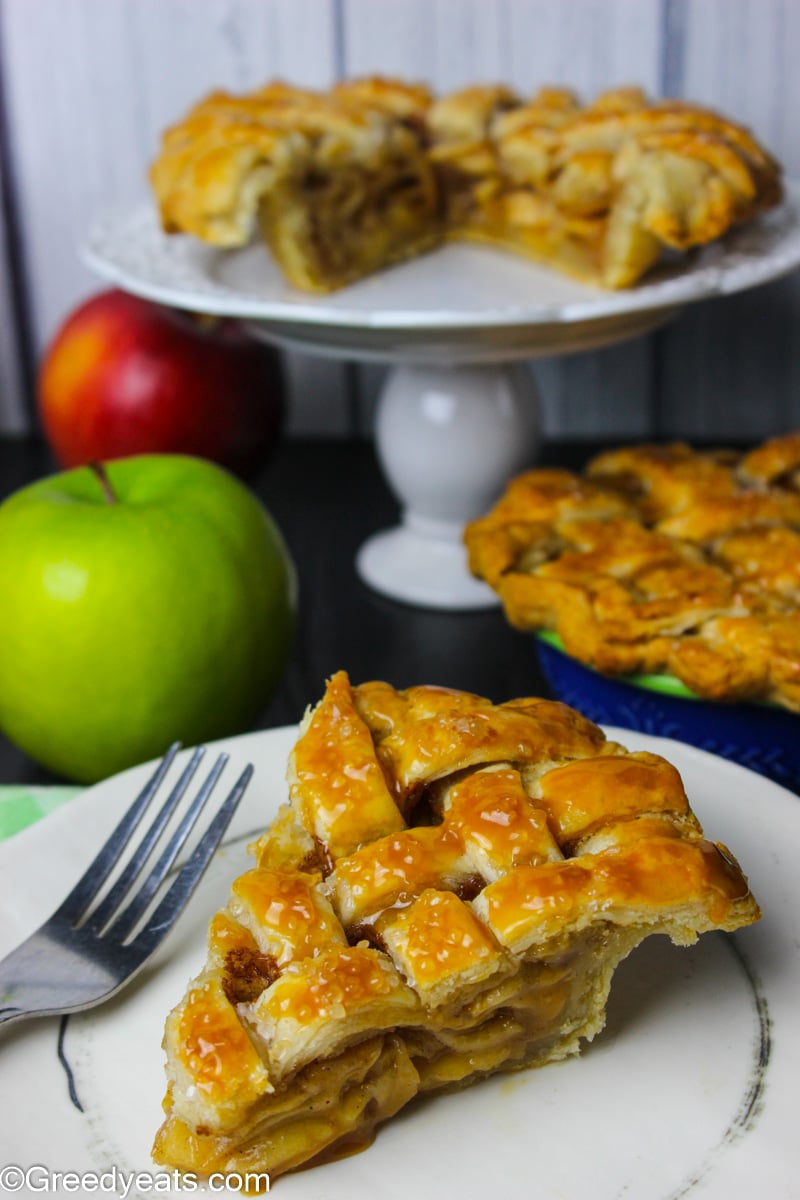 Easy Mini Apple Pie recipe slice that is flaky, buttery and drizzled with caramel on top!