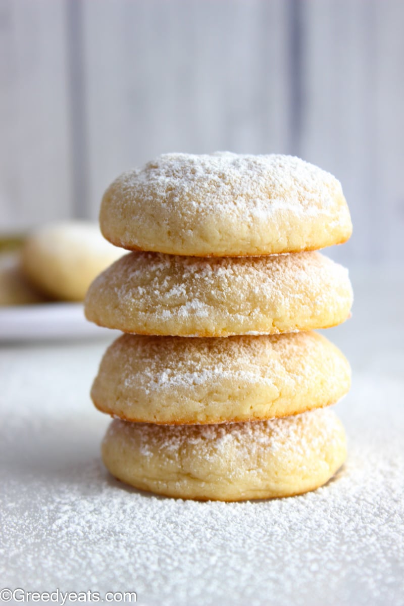 A stack of soft Cream Cheese Cookies made with easy ingredients, sprinkled with powdered sugar.