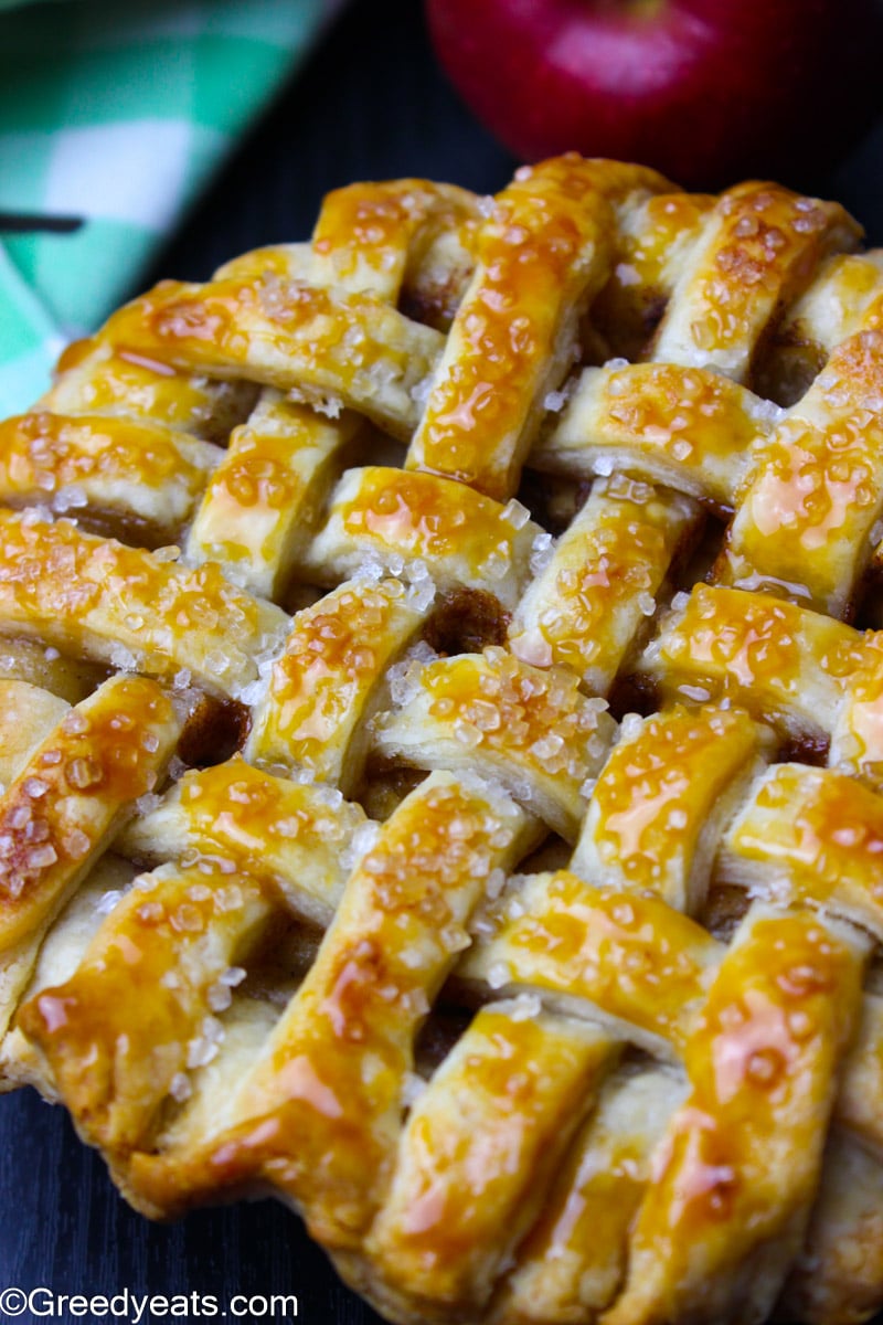 Mini Apple Pie recipe with golden all butter pie crust, drizzled with coarse sugar.