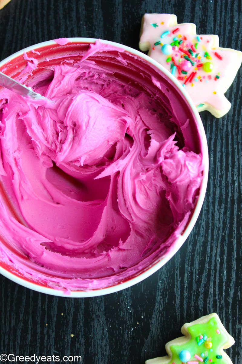 Smooth and silky Pink vanilla buttercream in a bowl ready to be frosted on cake.