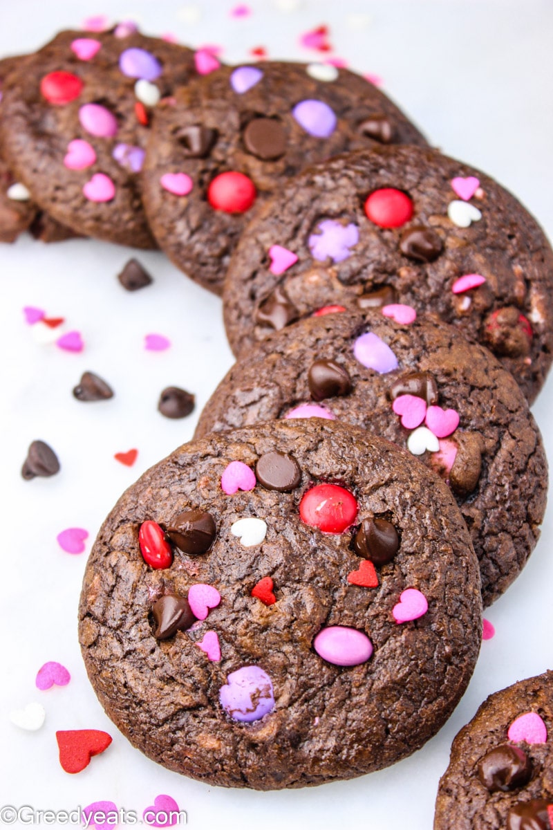 M&m Chocolate Chip Cookies stuffed with pink and red m&ms and chocolate chips.